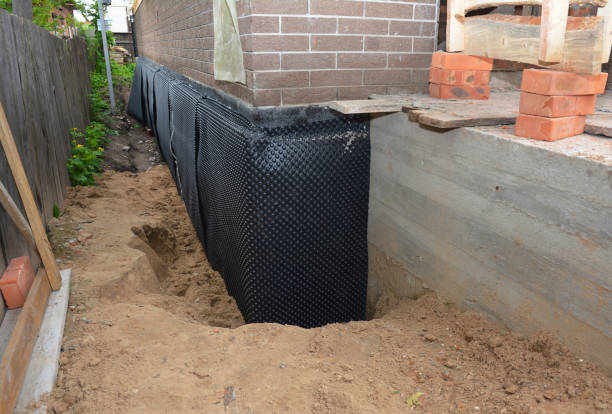 Happy homeowners after waterproofing job in Elizabeth